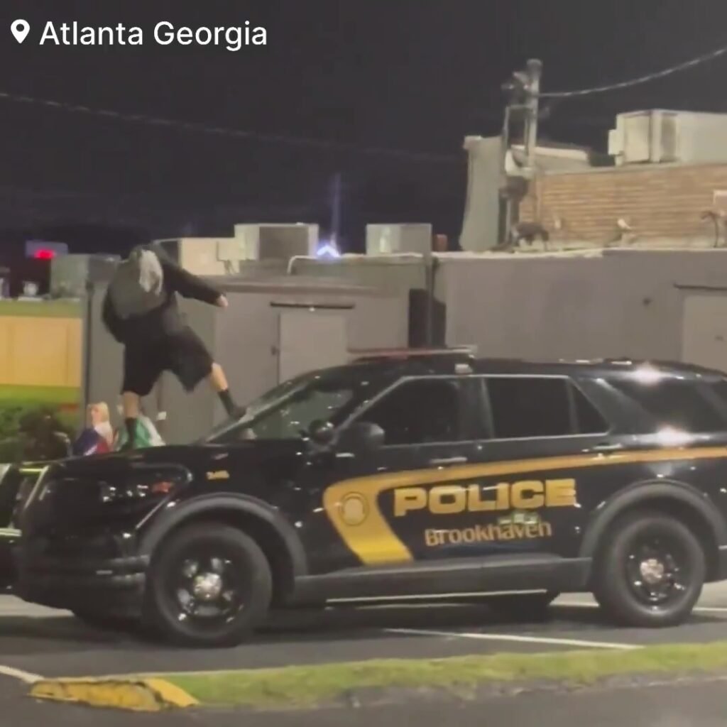 Destruction during anti-ICE protests in Atlanta as rioters destroy police vehicles.