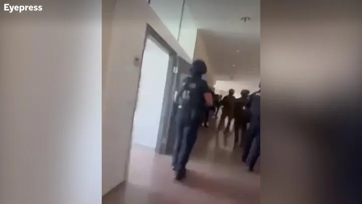 Flowers and candles left outside the school in Graz after the deadly shooting.